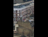 Man red sweater rooftop magic broom ride