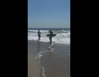 Man hold surfboard walk on the beach