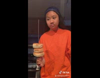 Girl bread on stick orange shirt icarly