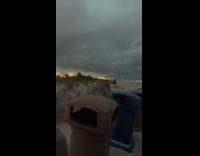 Woman video bombed submitter filming the beach
