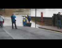 Kids dad ride green canoe through flood 