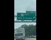 Exit 420 69 south sign over expressway road