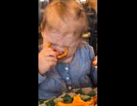 Young girl try to poke eyes with fries