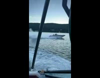Speedboat catches wave and goes airborne