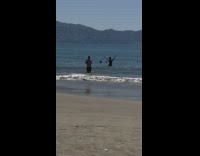 Lady Poses and Jumps as Man Takes Pictures