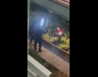 Man with mask wear costume video shoot in park at night 