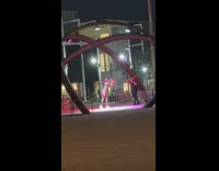 Woman camouflage outfit music video cave statue