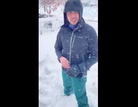 Guy builds an igloo with snow outside