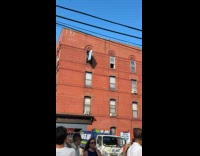 Guy throws down mattress from apartment window