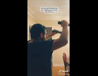 Husband shines flashlight on wife work laptop