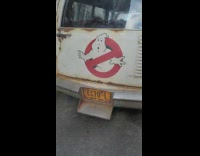 The rear of the ghost busters vehicle parked on street