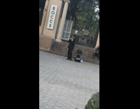 Older guy sings by brown bocce arch 