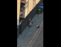 Man and woman green outfit pose sidewalk photoshoot