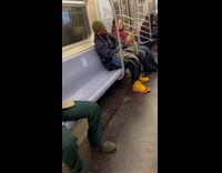 Man with cigarette counts money inside train