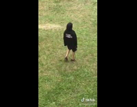 Kid boy backyard black hoodie scream sing 