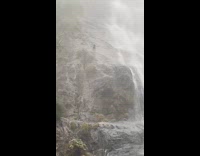 Man treks on falls during gloomy weather