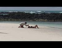 Woman black bikini lay on sand beach