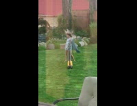 Little girl blue towel sing leaf blower