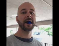 bald guy blue dart bullseye 