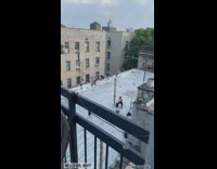 Guy films friend making music from bowls and pans 