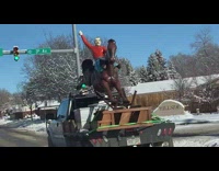 Man stature ride horse transported by truck