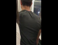 Man looks like guy working out on advertisement sign on subway train