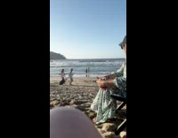 Man and woman photoshoot at the beach