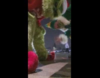 Grinch and buddy pose in parking lot 