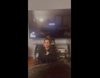Girl sitting in front of TV karaoke sings wrong song 