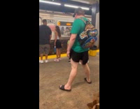 Guy wears cat tail wait for subway