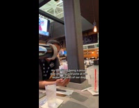 Guy showing dog pictures at airport 