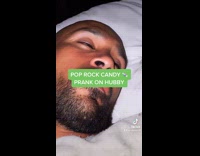 Wife pranks husband with poprocks candy while he is asleep 