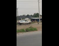 Car driving in wrong lane opposite way of traffic 