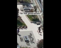 Two girls dance tiktok generation rooftop white tiles