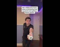 Guy plays wii bowling