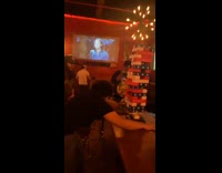 Guy uses belt for jenga game