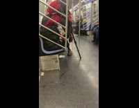 Person in Costume and Baby on its Mothers Lap Rests