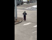Man walk towards camera at parking lot