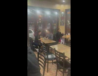 Woman throws water in guys face. 