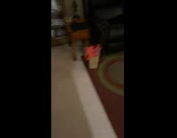Girl walks up stairs and scares friend 