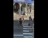 Woman sit golden chair pedestrian lane broadway