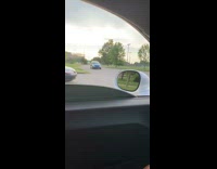 Blue car reverse down driveway quick and random guy dances