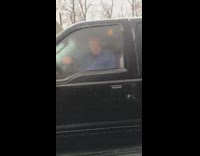 Man blue shirt head through ice truck
