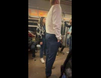 Man loosen button back of his pants