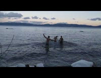 Three guys go into cold lake water