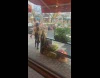 Woman brown long sleeves take small pumpkin