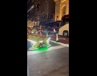 The Grinch drives around with loud music