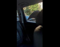 Man drives car hood up on road