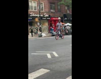 Guy red bicycle ball on head screams 