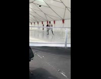 Man spin child upside down ice skate 